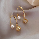 Pendientes colgantes retro en oro con margaritas